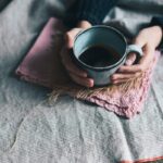 person holding green mug